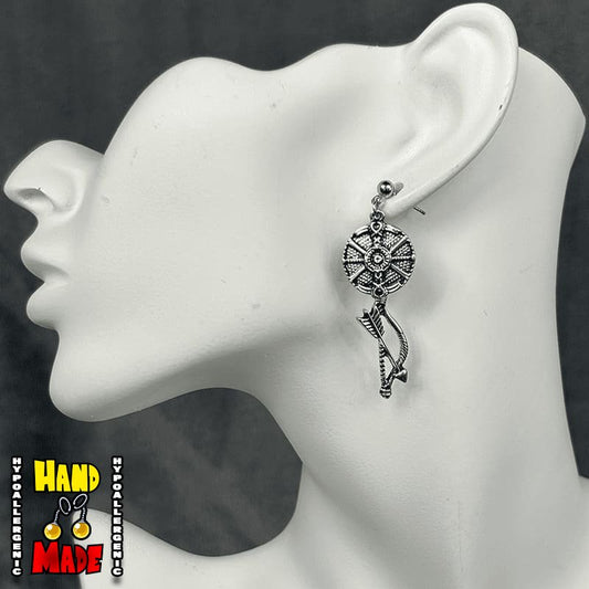Handmade Warrior Shield and Talon Bow Gaming Earrings featuring metal shield and talon bow charms with silver dropped posts.